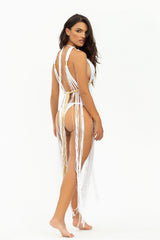 Back view of the Dianora dress, showcasing its intricate handwoven macramé design and elegant fringe movement.