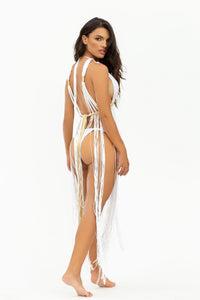 Back view of the Dianora dress, showcasing its intricate handwoven macramé design and elegant fringe movement.